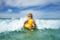 Cute boy in orange sunglasses with yellow inflatable duck Royalty Free Stock Photo