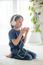 Cute boy with phone and head phones, listening music Royalty Free Stock Photo