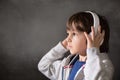 Cute boy with phone and head phones, listening music Royalty Free Stock Photo