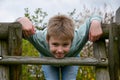 Cute lboy plays on a slide Royalty Free Stock Photo