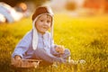 Cute boy, playing with airplane on sunset in the park Royalty Free Stock Photo