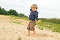 Cute boy playing on the beach Royalty Free Stock Photo