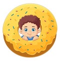 A cute boy playing with a big yellow donut toy Royalty Free Stock Photo
