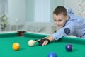 Cute boy playing billiard Royalty Free Stock Photo