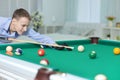 Cute boy playing billiard Royalty Free Stock Photo