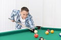 Cute boy playing billiard Royalty Free Stock Photo