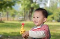 Cute boy playing bubbles Royalty Free Stock Photo