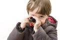Cute boy playing with miniature camera Royalty Free Stock Photo