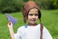 Cute boy playing with paper plane Royalty Free Stock Photo