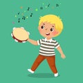 Cute boy playing tambourine on green background