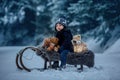 Cute boy playing with teddy bear in snow, winter time. Little toddler playing with toys on a snowy day Royalty Free Stock Photo