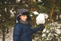 Cute boy plays with snow in a beautiful snow park in winter Royalty Free Stock Photo