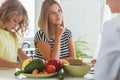 Boy and professional dietitian preparing a diet eating plan