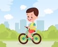 Cute boy riding bike on street. Summer outdoor activity cartoon vector Royalty Free Stock Photo
