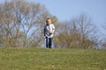 Cute boy running across grass und smiling Royalty Free Stock Photo