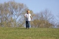 Cute boy running across grass und smiling Royalty Free Stock Photo