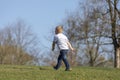 Cute boy running across grass und smiling Royalty Free Stock Photo