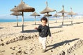 Cute boy running and playing on beach on Mallorca Royalty Free Stock Photo