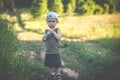 Cute boy in rural nature fields