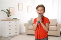 Cute boy singing in microphone Royalty Free Stock Photo