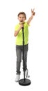 Cute boy singing in microphone on white Royalty Free Stock Photo