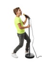 Cute boy singing in microphone on background Royalty Free Stock Photo