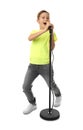 Cute boy singing in microphone on white Royalty Free Stock Photo