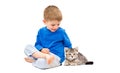 Cute boy sitting with a kitten Scottish Straight Royalty Free Stock Photo