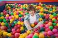 Cute boy smiling in ball pool Royalty Free Stock Photo