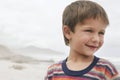 Cute Boy Smiling At Beach Royalty Free Stock Photo