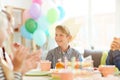 Cute Boy Smiling at Birthday Party Royalty Free Stock Photo