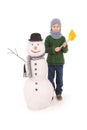 Cute boy with snowman with scarf and hat