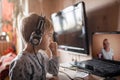 Cute boy talking with his grandmother within video chat on laptop, life in quarantine time Royalty Free Stock Photo