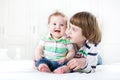 Cute boy talking to his baby sister Royalty Free Stock Photo