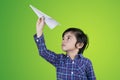 Cute boy throwing a paper plane Royalty Free Stock Photo