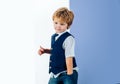 Cute boy with thumb up. Tie. Little gentleman. Male, style. Elegant man. Child denim fashion. Shy model. Attractive boy.