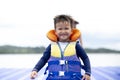 Cute boy using float to play on the water play park Royalty Free Stock Photo