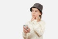 Cute boy using a smart phone over white background. Smart kid holding a mobile phone Royalty Free Stock Photo