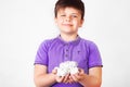 Cute boy holding paper bin full of crumpled papers surprised with an idea. promoting recycling of used paper