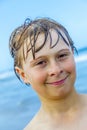 Cute boy with wet hair at the beach Royalty Free Stock Photo