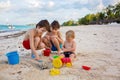 Cute  boys playing with beach toys on tropical beach Royalty Free Stock Photo