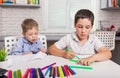 Cute boys studying drawing at school. Happy family drawing pictures. Royalty Free Stock Photo