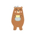 Cute brown grizzly bear with a honey jar