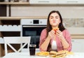 Cute Brunette Enjoys Hamburger