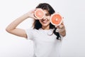 Cute Brunette Girl Popularizing Healthy Nutrition Posing With Cut Citruses Royalty Free Stock Photo