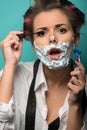 Cute brunette in hair curlers and foam posing with Royalty Free Stock Photo