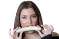 Cute brunette lady, eating a peeled banana Royalty Free Stock Photo