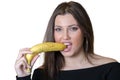 Cute brunette lady wear black shirt, holding and biting a banana Royalty Free Stock Photo