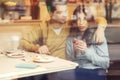 Cute brunette loving couple in cozy warm sweaters on a date at t Royalty Free Stock Photo