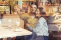 Cute brunette loving couple in cozy warm sweaters on a date at t Royalty Free Stock Photo